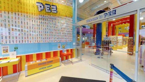 Brightly colored interior of the PEZ Visitor Center, featuring candy displays and a welcoming entrance.