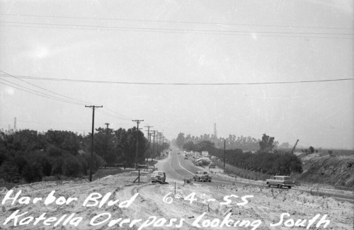 Black and white photo of Harbor Blvd, Katella Overpass, looking south, with cars and power lines visible, dated 6-4-55.