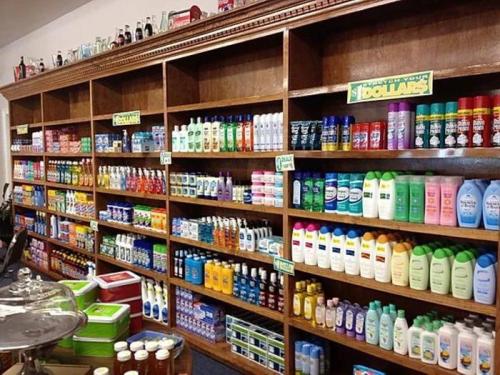 A well-organized shelf displaying a variety of personal care and cleaning products in a store.