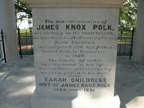 Stone monument inscription honoring James Knox Polk and Sarah Childress, detailing their lives and virtues.