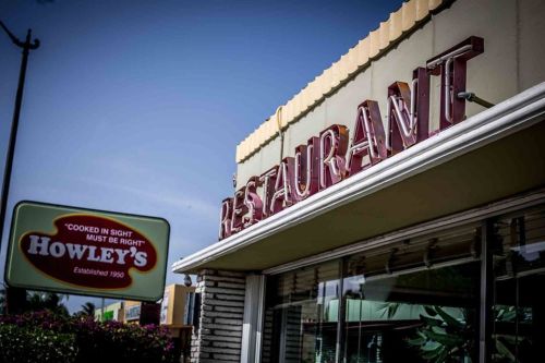 Signage of Howley's Restaurant, featuring a retro design and the slogan "Cooked in sight must be right."
