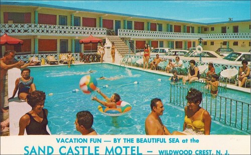 A vibrant pool scene at the Sand Castle Motel in Wildwood Crest, NJ, with guests enjoying the sun and water activities.