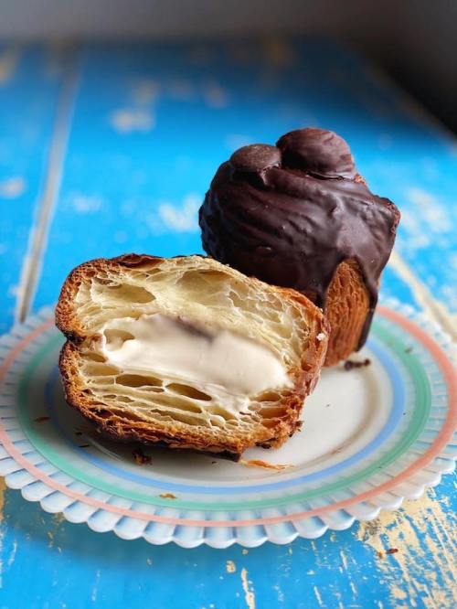 Abstract image featuring a muted background with colorful geometric shapes and patterns at the bottom.