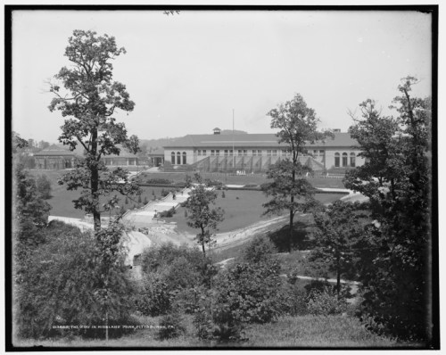 Historic black-and-white photo of a large building surrounded by trees and landscaped grounds in Pittsburgh, PA.