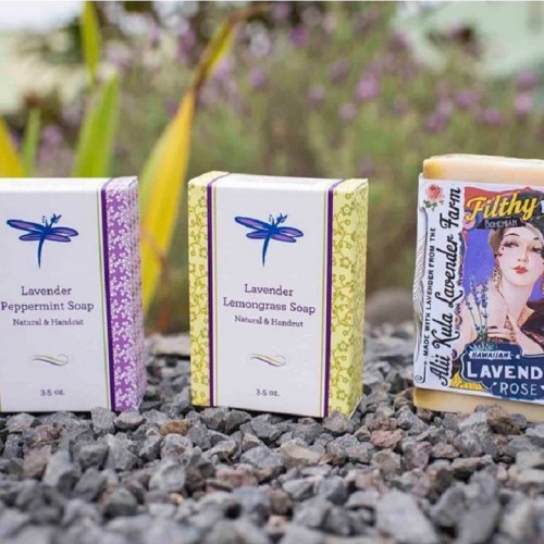 Three bars of soap in colorful packaging: lavender peppermint, lavender lemongrass, and a vintage-style lavender rose soap.
