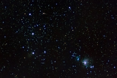 A starry night sky filled with numerous stars and a faint nebula, showcasing deep space beauty.