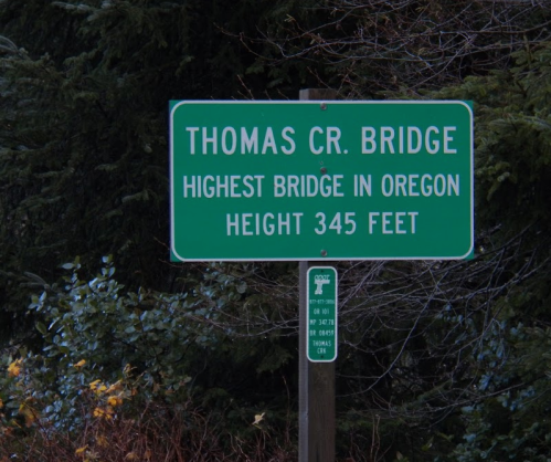 Sign for Thomas Cr. Bridge, stating it is the highest bridge in Oregon at a height of 345 feet.