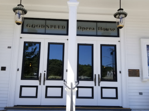Front entrance of the Goodspeed Opera House, featuring large glass doors and decorative lanterns.
