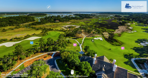 Aerial view of Deer Creek Golf Club, showcasing lush greens and scenic landscapes with water features in the background.