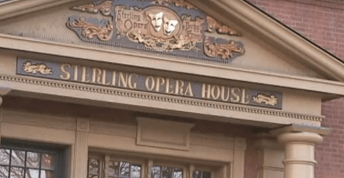 Entrance of the Sterling Opera House, featuring decorative elements and a sign with the name prominently displayed.