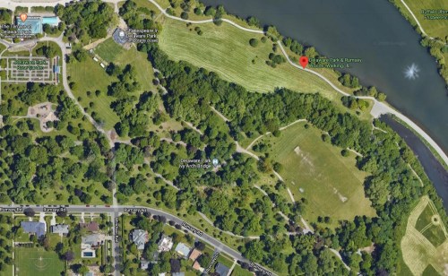 Aerial view of Delaware Park, featuring green spaces, walking paths, and a river.