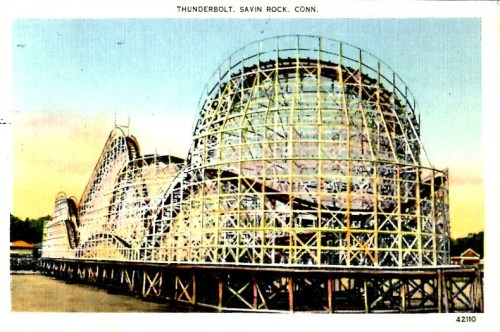 Vintage postcard of the Thunderbolt roller coaster at Savin Rock, Connecticut, showcasing its wooden structure and curves.