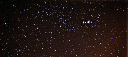 A starry night sky filled with numerous stars and clusters, showcasing deep blues and bright white points of light.