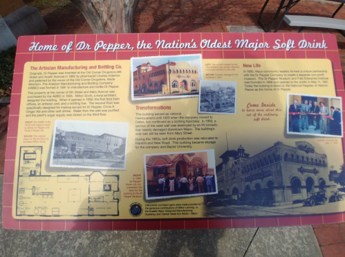 Sign about Dr Pepper's history, featuring its origins, transformations, and connection to Baylor University.