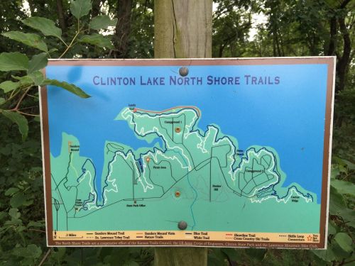 Map of Clinton Lake North Shore Trails, showing various trails, landmarks, and park areas in a green and blue design.