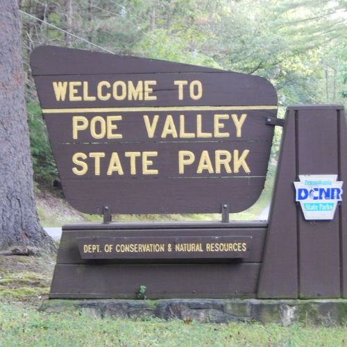Sign welcoming visitors to Poe Valley State Park, featuring the Pennsylvania Department of Conservation and Natural Resources logo.