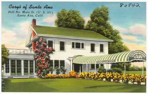 Vintage postcard of Cary's of Santa Ana, featuring a white house with a green awning and colorful flowers.