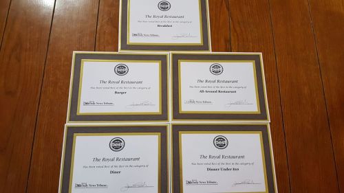 Five award certificates for The Royal Restaurant, recognizing categories like Breakfast, Burger, and Dinner Under 80.