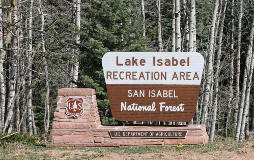 Sign for Lake Isabel Recreation Area in San Isabel National Forest, surrounded by trees. U.S. Department of Agriculture.
