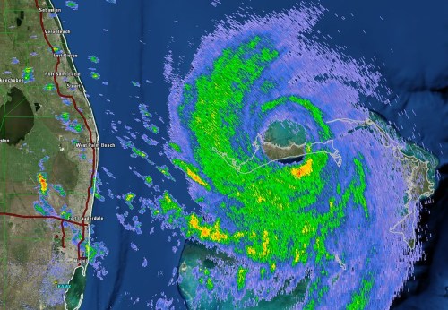 Radar image showing a large storm system with swirling patterns and precipitation over coastal areas.