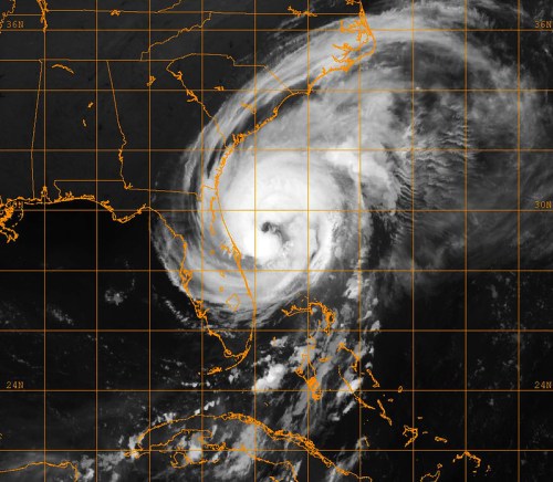 Satellite image of a hurricane approaching the southeastern coast of the United States, with visible cloud patterns.