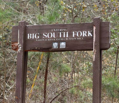 Sign for Big South Fork National River and Recreation Area, surrounded by trees and natural scenery.