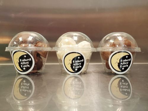 Three clear cups with lids, two filled with chocolate and one with vanilla ice cream, labeled "Baked After Dark."