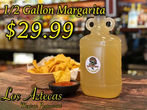 A half-gallon margarita priced at $29.99, served with tortilla chips and salsa at Los Aztecas Mexican Restaurant.