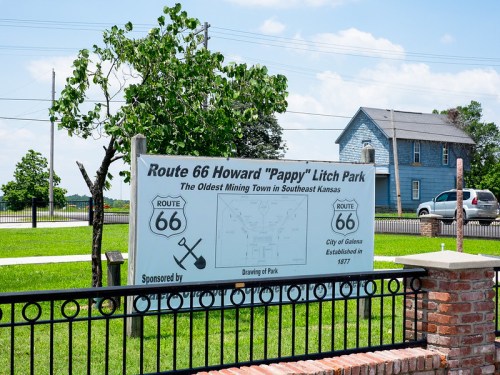 Sign for Route 66 Howard "Pappy" Litch Park, noting it as the oldest mining town in Southeast Kansas, established in 1877.
