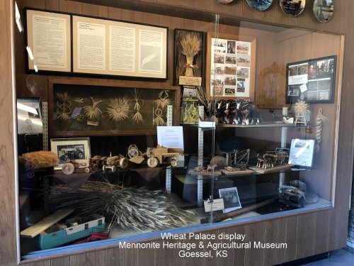 Display case at the Mennonite Heritage & Agricultural Museum featuring wheat-themed artifacts and historical photos.