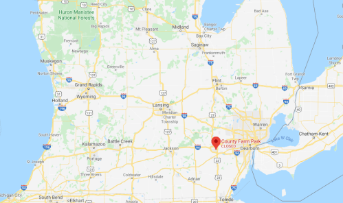 Map showing County Farm Park located southeast of Lansing, Michigan, with nearby highways and cities marked.