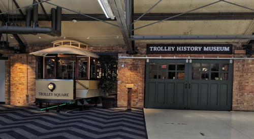 Interior of the Trolley History Museum featuring a vintage trolley and a sign reading "Trolley Square."