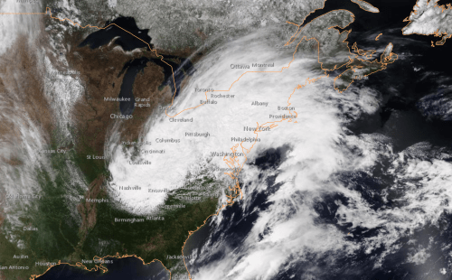 Satellite image showing a large storm system over the eastern United States, affecting multiple states and regions.