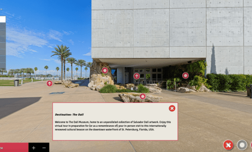 Exterior view of The Dali Museum in St. Petersburg, Florida, featuring modern architecture and palm trees.