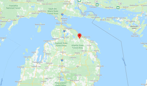 Map showing northern Michigan with a red marker indicating Rogers City, near Lake Huron.