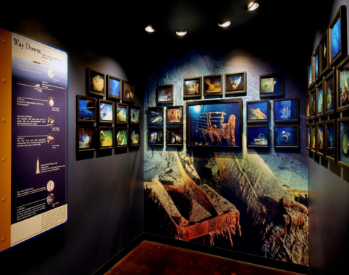 Exhibit featuring underwater photographs and artifacts, with informational panels on deep-sea exploration.