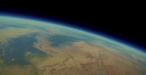 A view of Earth from space, showcasing landforms, greenery, and a blue atmosphere against a black backdrop.