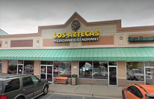 Exterior of Los Aztecas Mexican Restaurant, featuring a green awning and a sign above the entrance.
