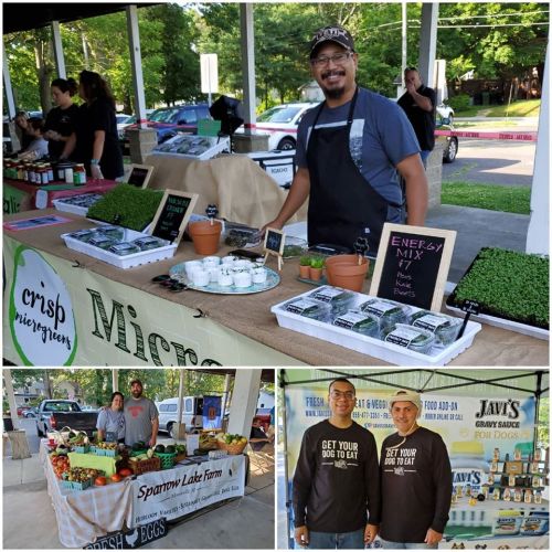 A farmer smiles at a market booth with microgreens, while two others showcase fresh produce and promote dog food.