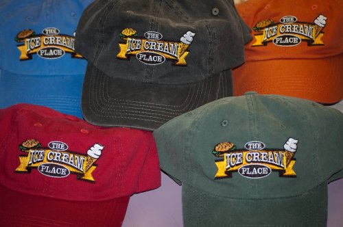 Five colorful caps featuring the embroidered logo of "The Ice Cream Place."
