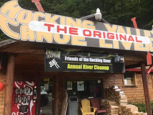 Sign for Hocking Valley Canoe Livery with a banner for the Friends of the Hocking River Annual Cleanup event.