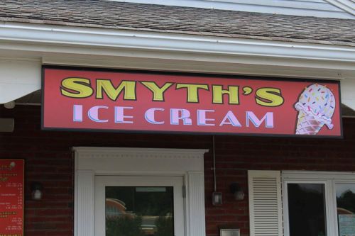 Sign for "Smyth's Ice Cream" featuring a colorful ice cream cone with sprinkles.