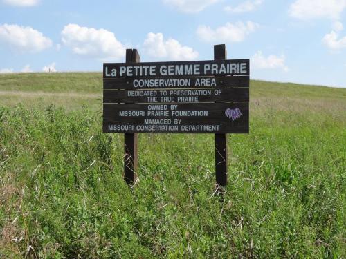 Sign for La Petite Gemme Prairie Conservation Area, highlighting its dedication to preserving true prairie landscapes.