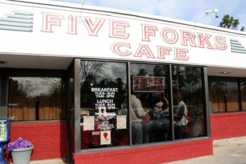 Exterior of Five Forks Cafe with an "OPEN" sign, featuring hours for breakfast and lunch.