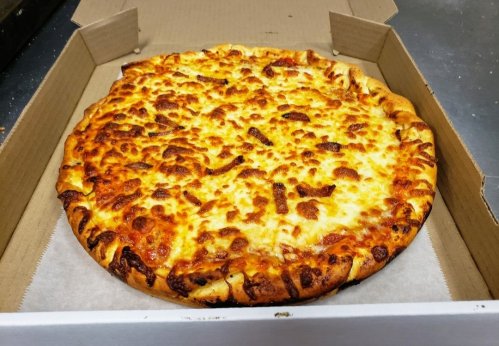 A freshly baked cheese pizza in a cardboard box, with a golden, crispy crust and melted cheese on top.