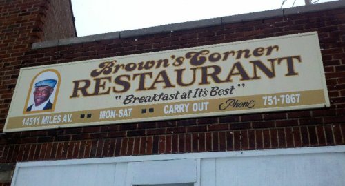 Sign for Brown's Corner Restaurant featuring a photo, with the tagline "Breakfast at It's Best" and contact details.