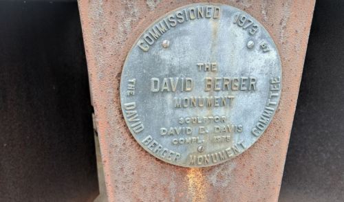 Plaque on a monument, reading "Commissioned 1973 by The David Berger Monument, Sculptor David E. Davis."