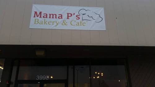 Sign for "Mama P's Bakery & Café" displayed on a building exterior. Address: 3990.