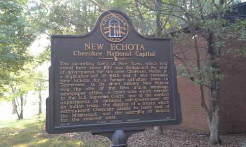 Sign detailing the history of New Echota, the Cherokee National Capital, in Georgia, established in 1825.