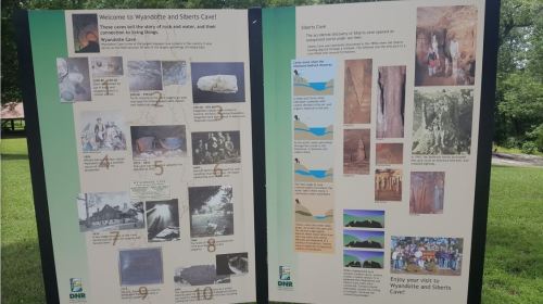 Informational panels about Wyandotte and Sherts Caves, featuring images and descriptions of their history and geology.